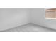Small bedroom with modern carpeting and a window for natural light at 17841 W Windsor Blvd, Litchfield Park, AZ 85340