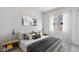 Modern bedroom with a comfortable bed, stylish pillows, neutral colors, and minimalist decor at 17841 W Windsor Blvd, Litchfield Park, AZ 85340