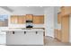 Bright kitchen featuring sleek white countertops, an island, and ample wood cabinets, perfect for cooking and entertaining at 17841 W Windsor Blvd, Litchfield Park, AZ 85340