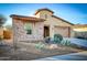 Attractive home with a stone facade, desert landscaping, and a two-car garage at 18107 W Thunderhill Pl, Goodyear, AZ 85338