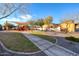 Community playground surrounded by lush landscaping and a shaded picnic area, ideal for Gathering fun at 18107 W Thunderhill Pl, Goodyear, AZ 85338