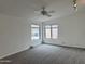 Neutral bedroom featuring new carpet and natural light from the large window at 1822 E Roma Ave, Phoenix, AZ 85016