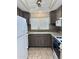 Well-organized kitchen featuring updated appliances, granite countertops, and storage solutions at 1822 E Roma Ave, Phoenix, AZ 85016