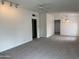 Bright living room featuring new carpet and ceiling fan at 1822 E Roma Ave, Phoenix, AZ 85016