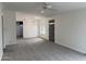 Inviting living room featuring carpet, a ceiling fan, and ample natural light at 1822 E Roma Ave, Phoenix, AZ 85016