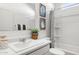 Clean bathroom featuring a vanity, toilet, and shower with a patterned curtain at 18353 W Gray Fox Trl, Wittmann, AZ 85361