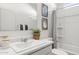 Bright bathroom featuring a vanity with sink, decorative accents, and a shower with a striped curtain at 18353 W Gray Fox Trl, Wittmann, AZ 85361