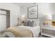 Fresh bedroom with modern decor, closet with sliding doors and comfortable bed at 18353 W Gray Fox Trl, Wittmann, AZ 85361