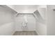 Walk-in closet with spacious shelving and a white robe at 18353 W Gray Fox Trl, Wittmann, AZ 85361