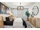 Serene bedroom with natural light, a well-dressed bed, side tables and attractive decor at 18353 W Gray Fox Trl, Wittmann, AZ 85361