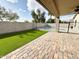 Backyard features artificial grass, a brick patio, and a pool at 1892 S Arroyo Ln, Gilbert, AZ 85295