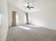 Bright and spacious bedroom with neutral carpet, vaulted ceiling and a pair of windows at 1892 S Arroyo Ln, Gilbert, AZ 85295