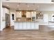 Bright, open kitchen with stainless steel appliances, granite countertops, and center island with pendant lighting at 1892 S Arroyo Ln, Gilbert, AZ 85295