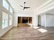 Bright living room featuring built-in shelving, large windows, and ample natural light at 1892 S Arroyo Ln, Gilbert, AZ 85295