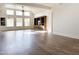 Open-concept living room with high ceilings, large windows, and custom built-in shelving at 1892 S Arroyo Ln, Gilbert, AZ 85295