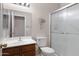 Bathroom with tile floors, vanity, toilet, and a walk-in shower at 19616 N Toya St, Maricopa, AZ 85138