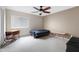 Neutral bedroom featuring a window, carpet flooring, and ceiling fan at 19616 N Toya St, Maricopa, AZ 85138