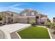 Charming two-story home featuring a spacious three-car garage, long driveway and well manicured lawn and backyard patio at 19616 N Toya St, Maricopa, AZ 85138