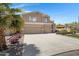 Charming two-story home featuring a spacious three-car garage, nice driveway and lawn and backyard patio at 19616 N Toya St, Maricopa, AZ 85138