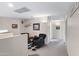 Bright hallway featuring neutral walls, carpet flooring, and inviting decor at 19616 N Toya St, Maricopa, AZ 85138