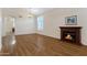 The bright and spacious living area has a fireplace and natural light from multiple windows at 19616 N Toya St, Maricopa, AZ 85138