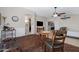 Open-concept living space featuring hardwood floors, neutral walls, and modern lighting at 19616 N Toya St, Maricopa, AZ 85138