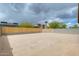 View of the large, private backyard with a wood and block fence, ready for landscaping at 1979 N Vista Ln, Casa Grande, AZ 85122