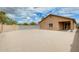 Spacious backyard with block fence, blue skies, and desert landscaping at 1979 N Vista Ln, Casa Grande, AZ 85122