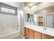 Well-lit bathroom with a shower-tub combo, large vanity, and a large mirror at 1979 N Vista Ln, Casa Grande, AZ 85122