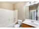 Clean bathroom featuring a tub/shower combo, a toilet, and a single sink vanity at 1979 N Vista Ln, Casa Grande, AZ 85122