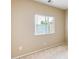 Cozy carpeted bedroom with a window and neutral-colored walls at 1979 N Vista Ln, Casa Grande, AZ 85122