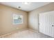 Neat bedroom with carpet, a window with blinds, and a sliding-door closet at 1979 N Vista Ln, Casa Grande, AZ 85122