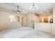 Spacious living room with neutral carpet, ceiling fans, and an open layout at 1979 N Vista Ln, Casa Grande, AZ 85122