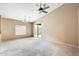 Bright living room with vaulted ceilings, sliding glass door to the patio, and neutral carpet at 1979 N Vista Ln, Casa Grande, AZ 85122
