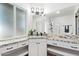 Updated bathroom featuring white cabinets, granite countertop, and natural light at 2425 W Shady Glen Ave, Phoenix, AZ 85023