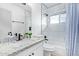 Bright bathroom featuring marble-look shower surround, updated sink and vanity at 2425 W Shady Glen Ave, Phoenix, AZ 85023