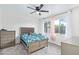 Bright bedroom with a large window, carpet, dresser, and ceiling fan at 2425 W Shady Glen Ave, Phoenix, AZ 85023