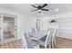 Elegant dining room with a marble table, comfortable seating, and built-in shelving at 2425 W Shady Glen Ave, Phoenix, AZ 85023