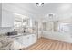 Bright kitchen with granite countertops, white cabinets, and stainless steel sink with views at 2425 W Shady Glen Ave, Phoenix, AZ 85023