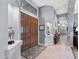 Grand foyer featuring double doors, tile flooring, and an elegant display niche with views to other rooms at 2452 W Enfield Way, Chandler, AZ 85286