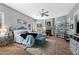 Spacious main bedroom with a decorative fireplace, plush bed, and ample natural light from the windows at 2452 W Enfield Way, Chandler, AZ 85286
