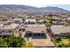 A stunning aerial view of the house and its beautiful desert surrounding and mountain backdrop at 2612 W Summerside Rd, Phoenix, AZ 85041