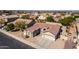 This home boasts a tiled roof and spacious three-car garage, nestled in an attractive neighborhood at 2612 W Summerside Rd, Phoenix, AZ 85041