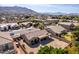 Stunning aerial view of the home with a covered patio, landscaped yard, and beautiful mountain views at 2612 W Summerside Rd, Phoenix, AZ 85041