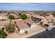 A serene aerial view showcasing the house in its community, surrounded by beautiful desert scenery at 2612 W Summerside Rd, Phoenix, AZ 85041