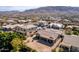 Expansive aerial view of a residential neighborhood with beautiful mountain views and desert landscaping at 2612 W Summerside Rd, Phoenix, AZ 85041
