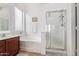 Bathroom featuring a tub, shower, vanity, and neutral decor at 2612 W Summerside Rd, Phoenix, AZ 85041