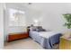 Bright bedroom with one window, carpet and neutral colored walls at 2612 W Summerside Rd, Phoenix, AZ 85041