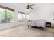 Bright bedroom has many windows for natural light and neutral carpeting at 2612 W Summerside Rd, Phoenix, AZ 85041