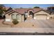 Inviting front exterior view of a home with desert landscaping and a large garage at 2612 W Summerside Rd, Phoenix, AZ 85041
